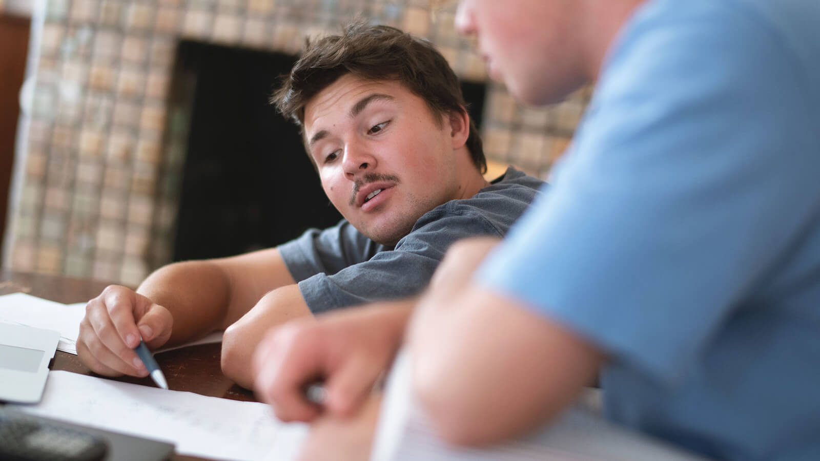 Two students looking at their AP course notes