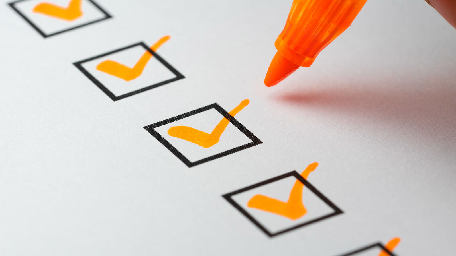 a checklist with orange check marks