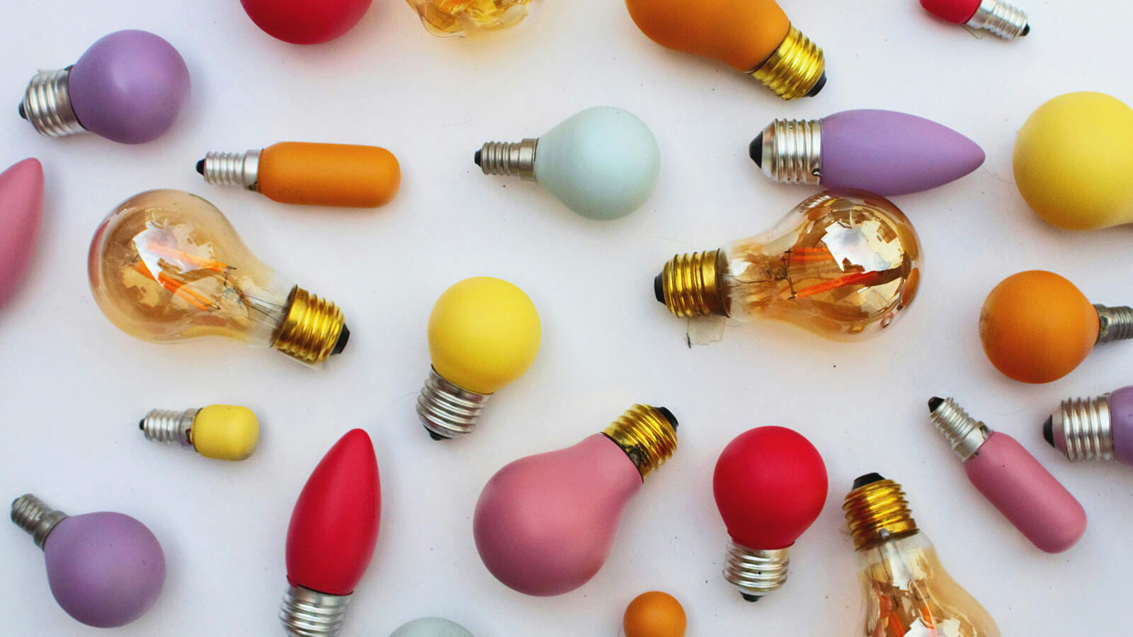 colorful light bulbs scattered on a table