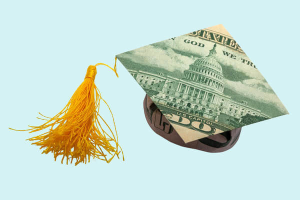 a graduation cap with printed money on the top