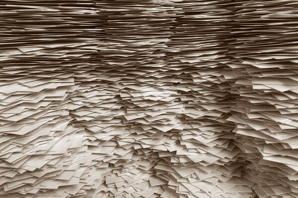 a big pile of paper transcripts